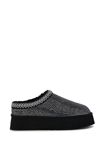 black platform slip on slipper with crystal embellished upper and delicate stitching around the opening