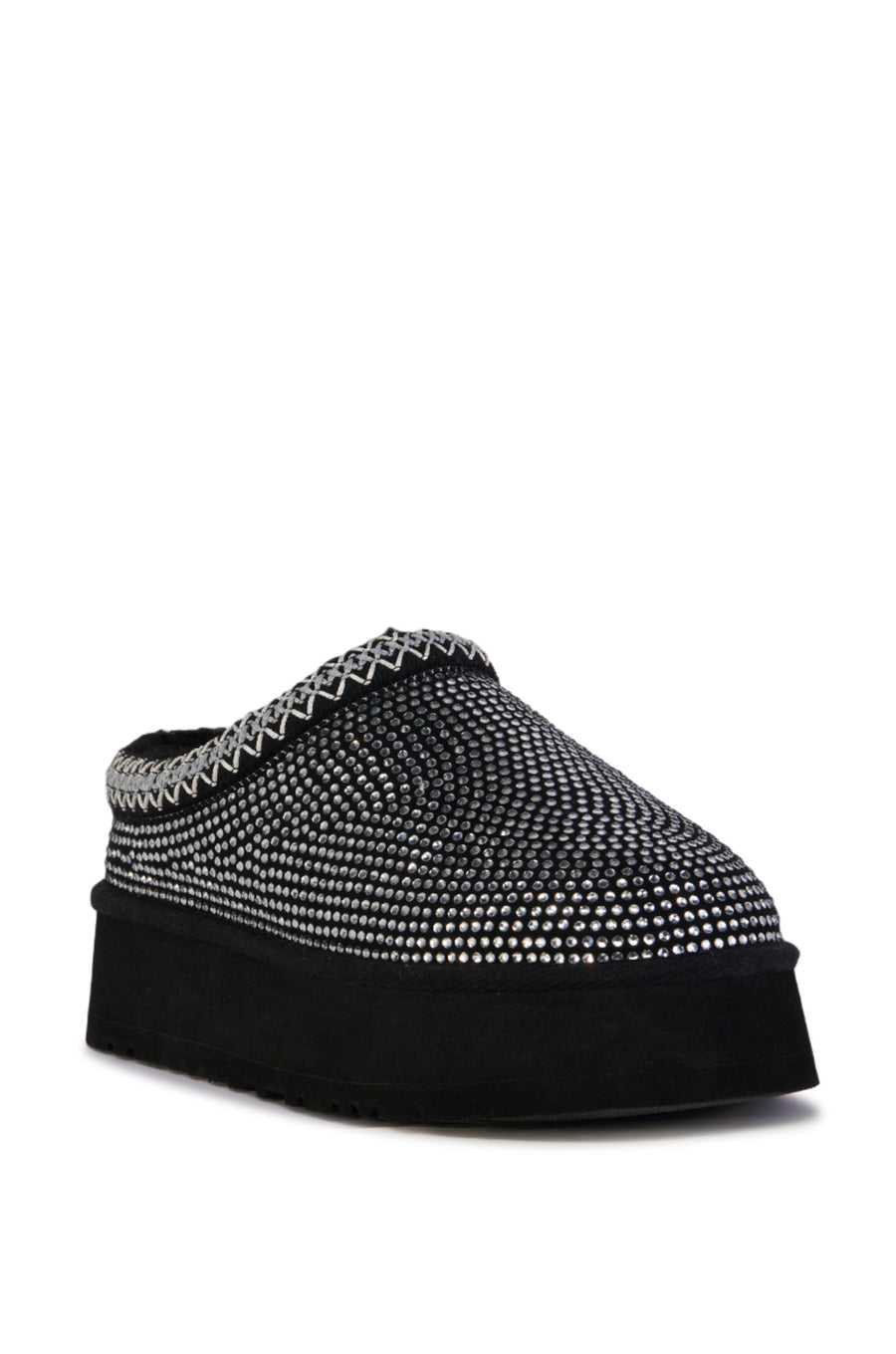 black platform slip on slipper with crystal embellished upper and delicate stitching around the opening