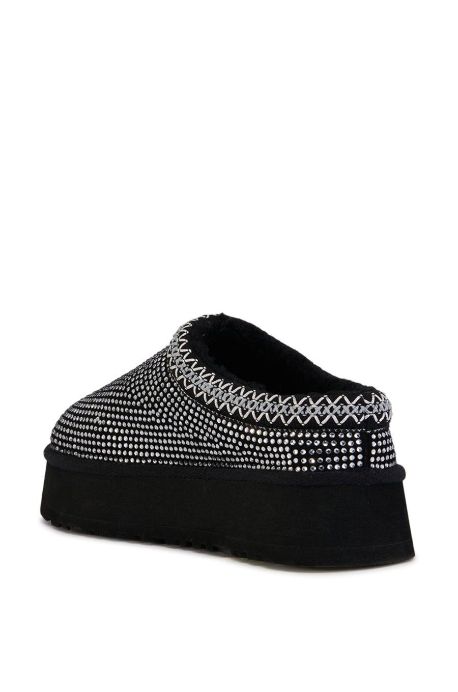 black platform slip on slipper with crystal embellished upper and delicate stitching around the opening