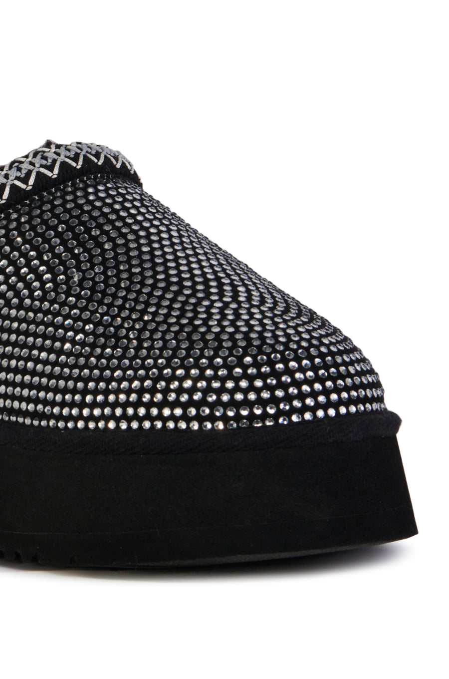 black platform slip on slipper with crystal embellished upper and delicate stitching around the opening