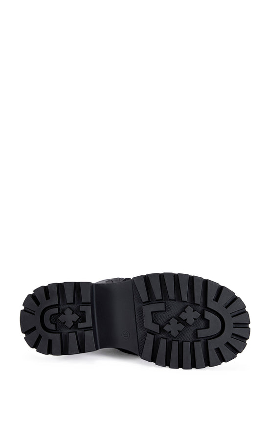black faux leather mid calf length combat bootie with a chunky platform sole and  black faux leather flower embellishments on the shaft
