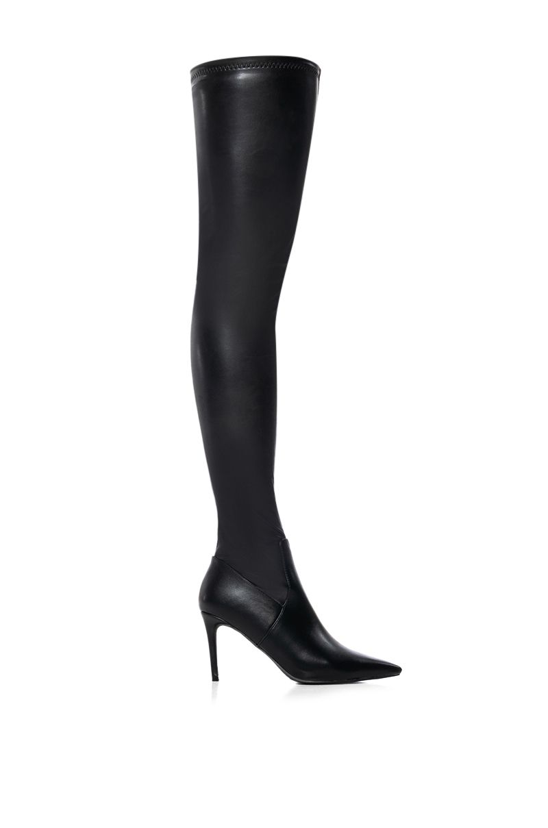 Black faux leather thigh high pointed toe stiletto boots made with versatile 4 way stretch material