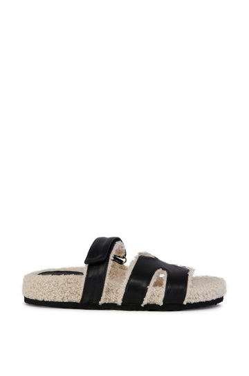 black faux leather open toe slipper with a sherpa lined sole and inner strap