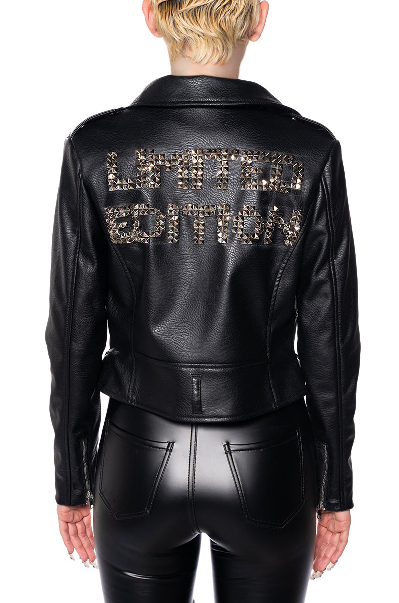 back view of black faux leather cropped moto jacket with a statement embellished "limited edition" written on the back of the jacket