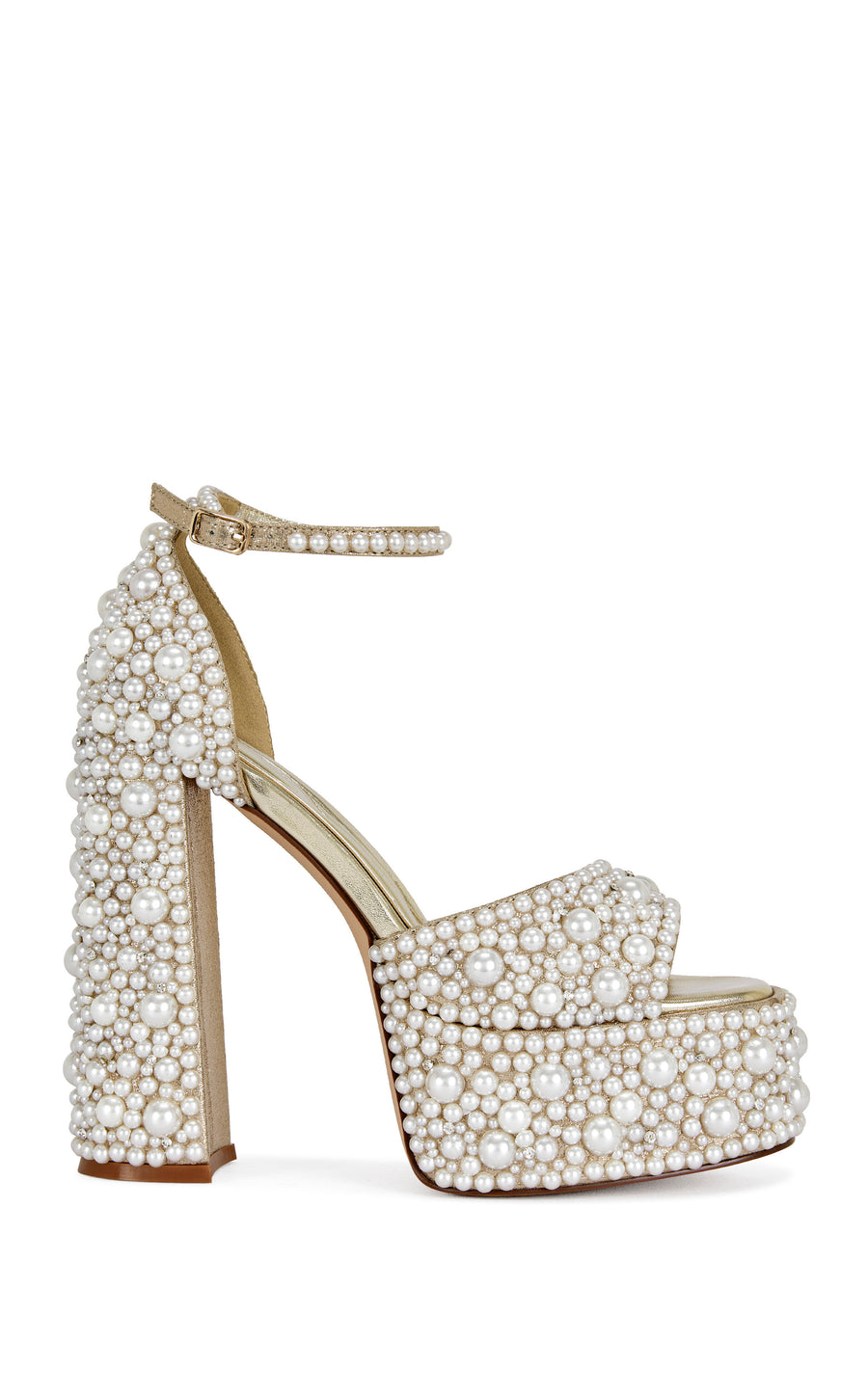 gold faux leather statement platform heels with an open toe, block heel, adjustable ankle straps adorned with faux pearl embellishments all over the heel