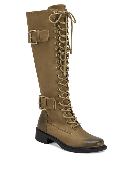 Brown faux suede lace up knee high combat boots with belted buckle accents on the shaft