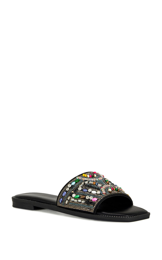 black faux leather slip on flat sandal with a colorful crystal embellished foot strap