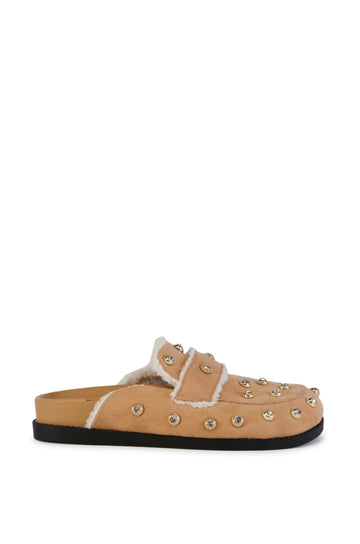 beige slip on flat mule with a faux sherpa lining and and silver studded embellishments