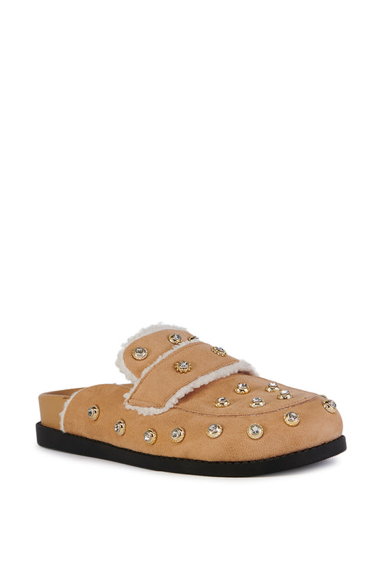 beige slip on flat mule with a faux sherpa lining and and silver studded embellishments