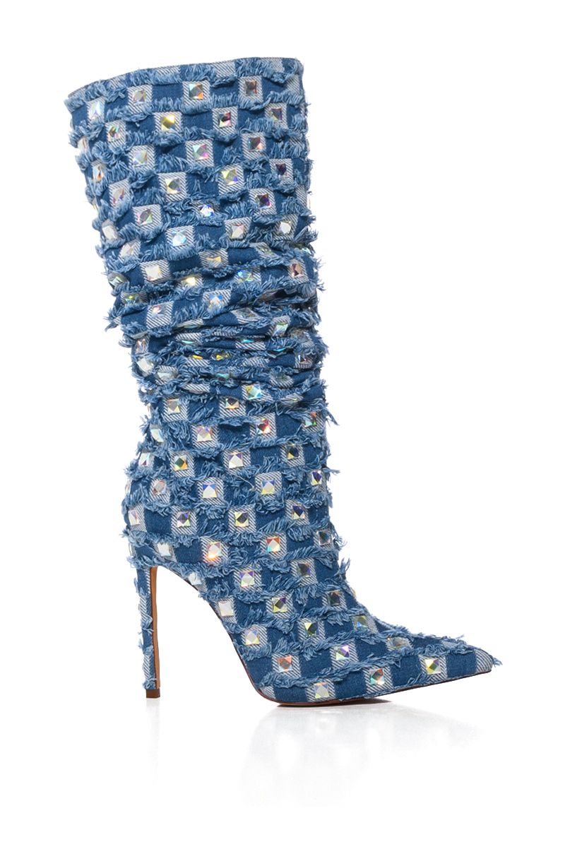 side view of pointed toe stiletto boots with mid calf length and denim fabrication with checker print fringe and rhinestone studded accents