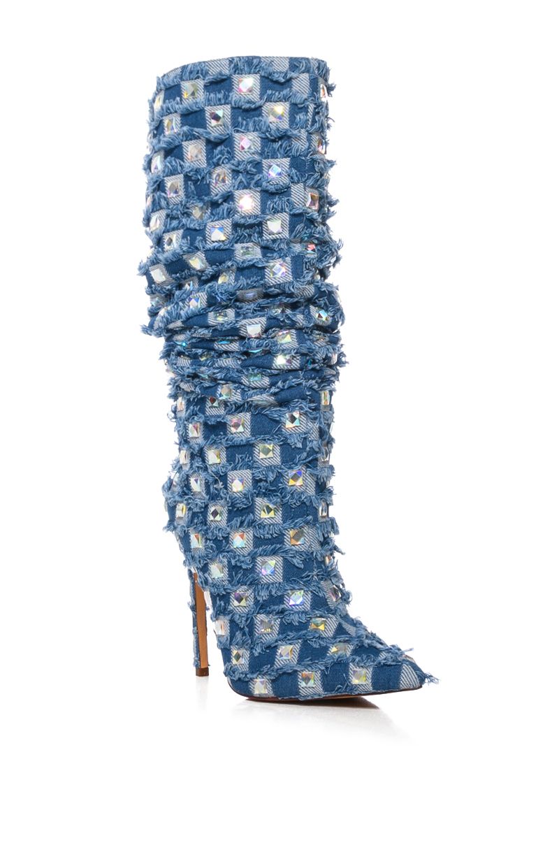 angled view of pointed toe stiletto boots with mid calf length and denim fabrication with checker print fringe and rhinestone studded accents