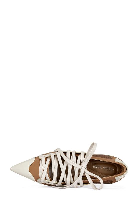 sporty and chic statement pumps featuring a brown and white faux leather construction, a pointed toe silhouette, a stiletto heel, and a lace up accent 