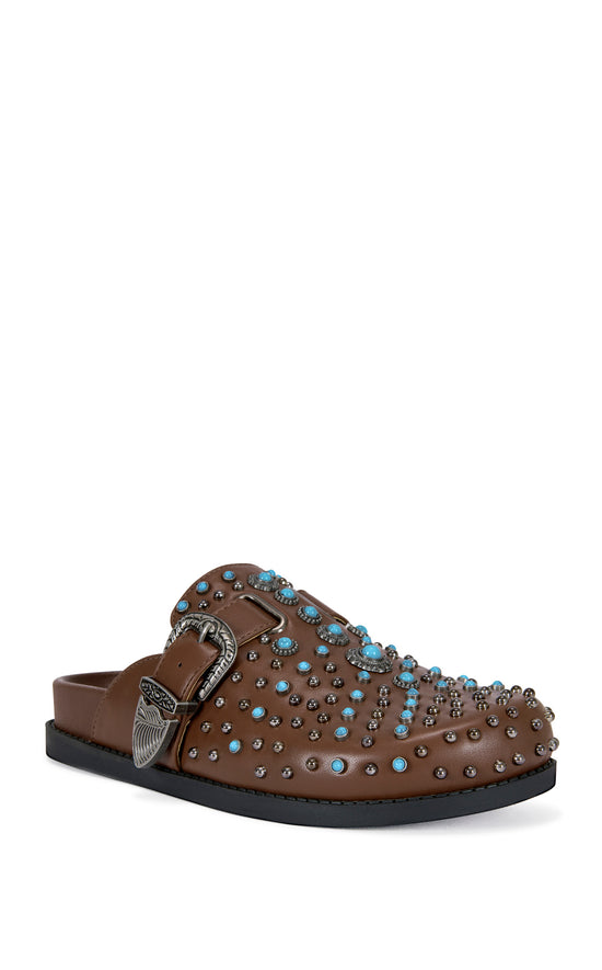 brown faux leather slip on flat mules with a western inspired belted accent with turquoise and stud embellishments