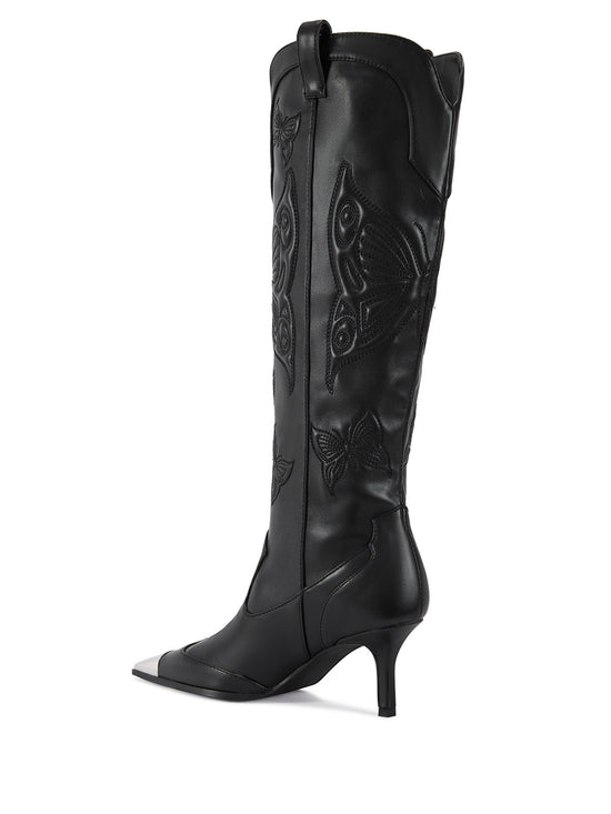 black faux leather pointed toe western inspired boots with a subtle stiletto heel and a butterfly design on the shaft