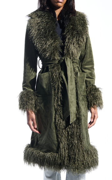 olive green faux suede statement trench coat with two front pockets, a faux fur lined collar and sleeves, and a tie up waist closure