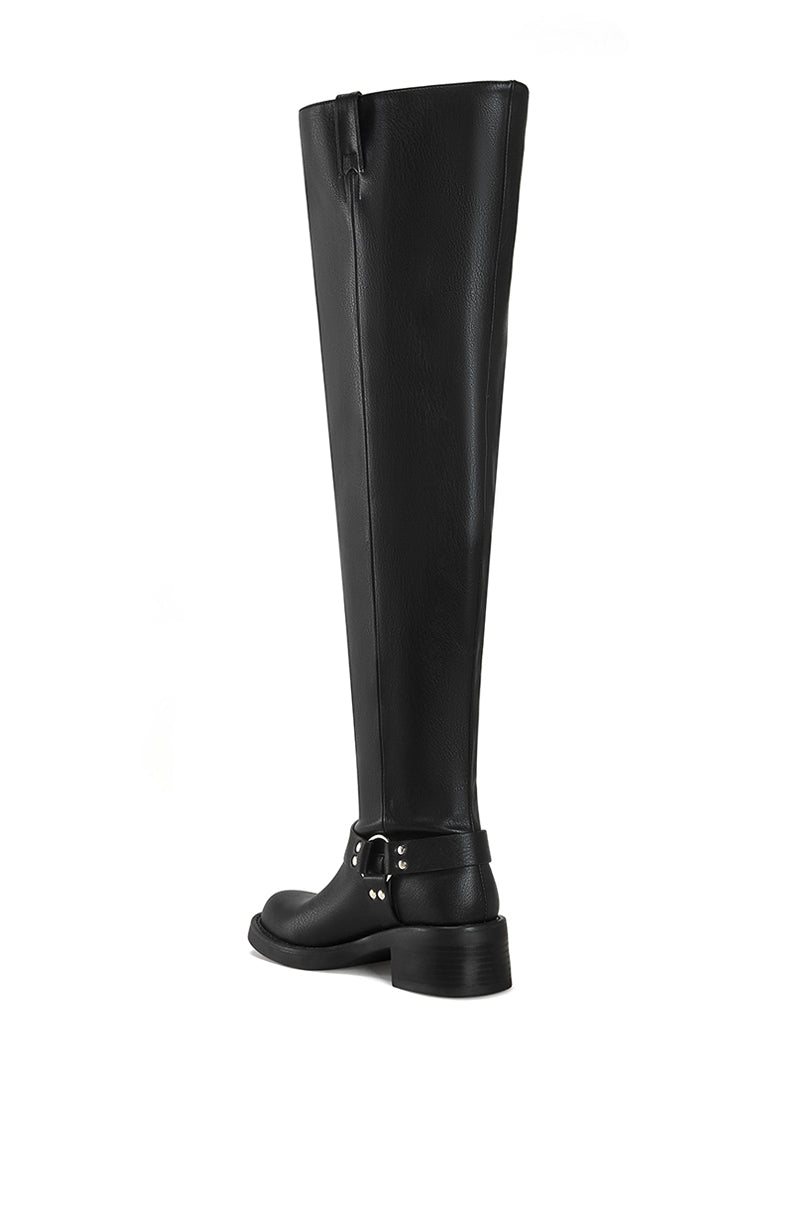 back view of black faux leather over the knee boot with a biker boot silhouette and silver hardware accent on the ankle