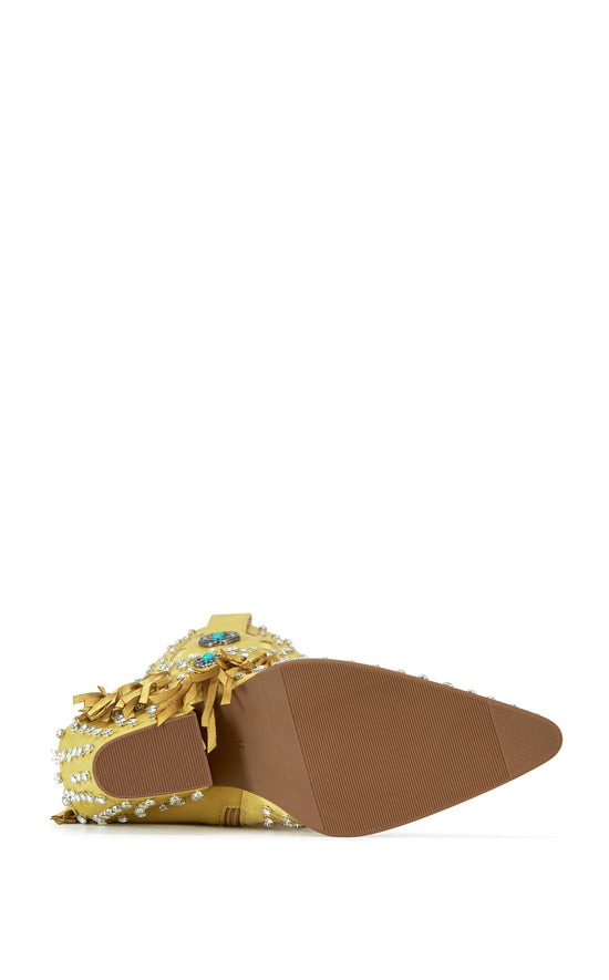 yellow faux leather statement western mid calf length boots with faux swede fringe, rhinestone embellishments, and turquoise flower accents on the shaft