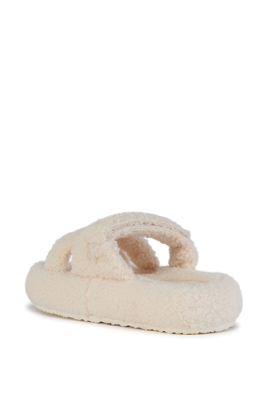 white faux sherpa slip on open toe slippers with an adjustable velcro foot strap