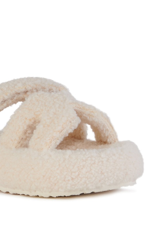 white faux sherpa slip on open toe slippers with an adjustable velcro foot strap