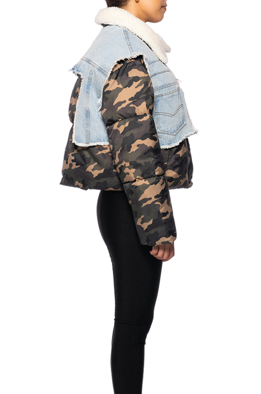 side view of camo print cropped puffer jacket with light wash denim accent and white shearling collar