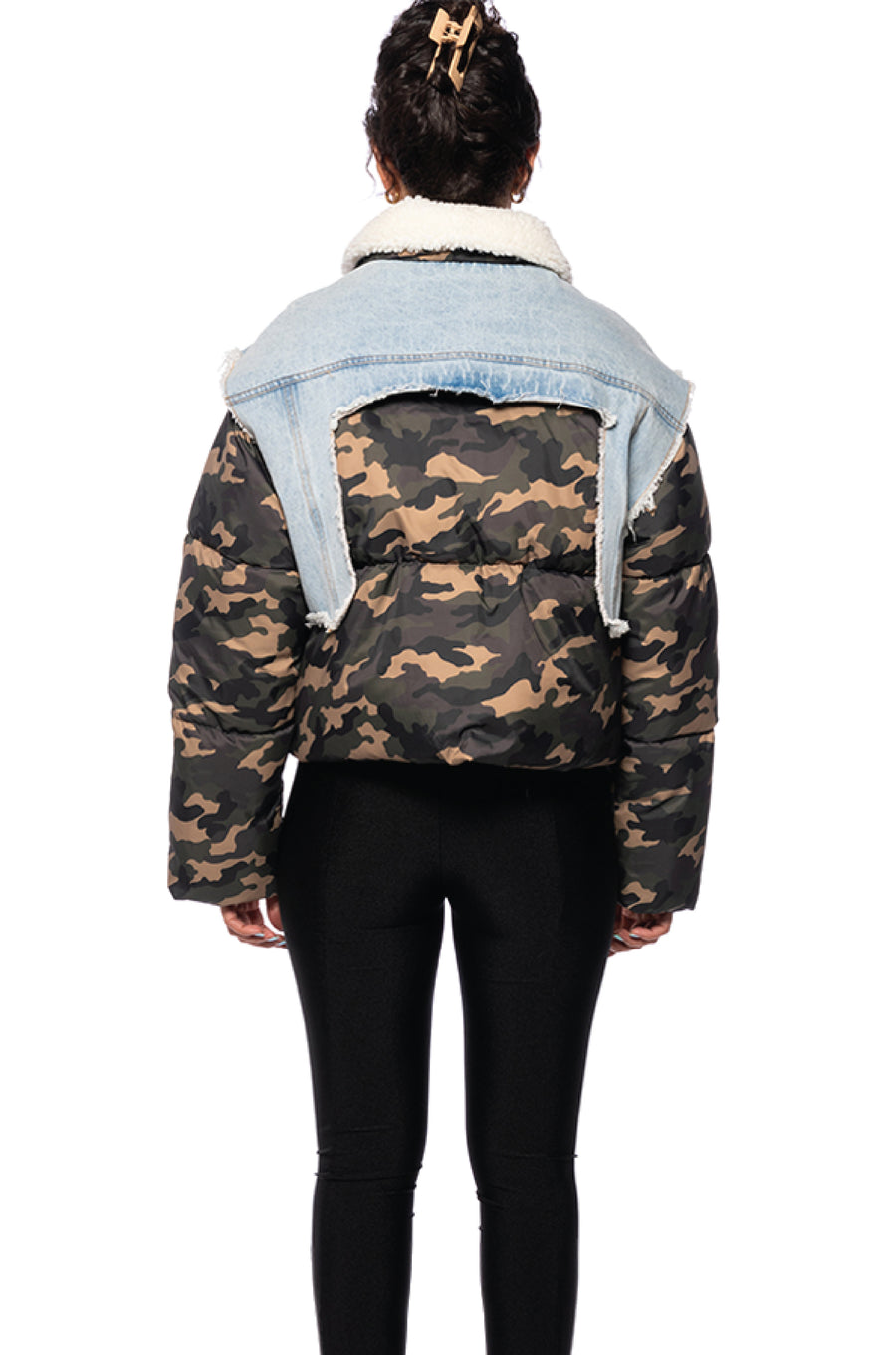 back view of camo print cropped puffer jacket with light wash denim accent and white shearling collar