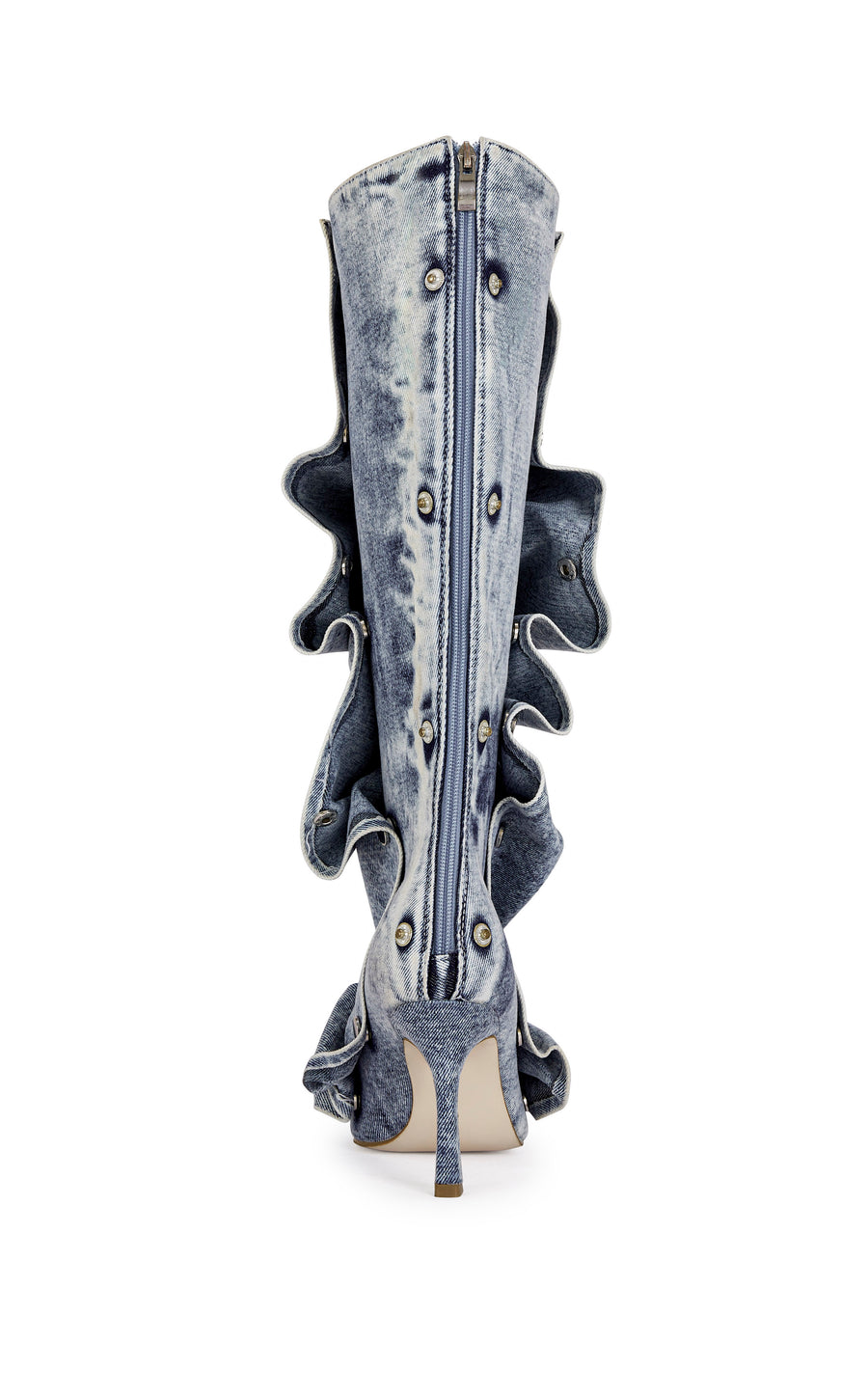denim statement knee high boot with a pointed toe, stiletto heel, a removable denim snap overlay, and a zip up closure on the back