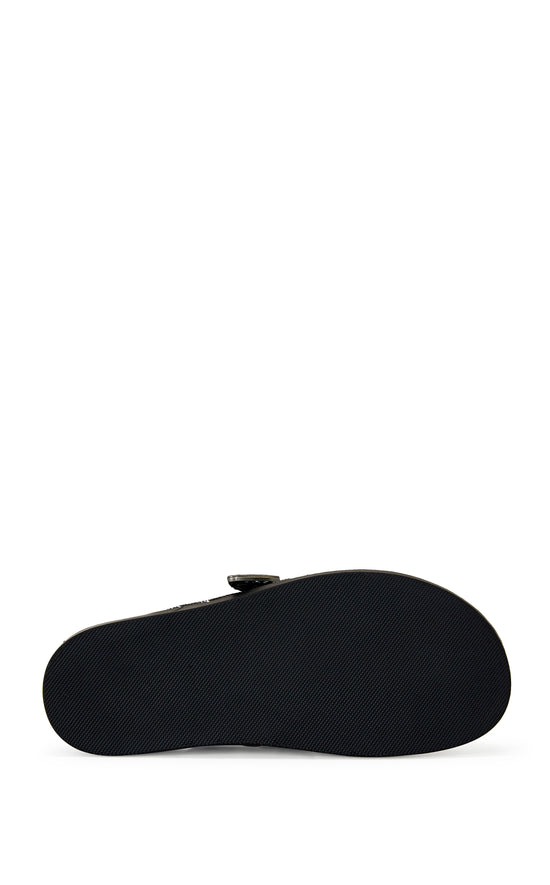 black square print slip on flat mules with a western inspired belted accent on the upper