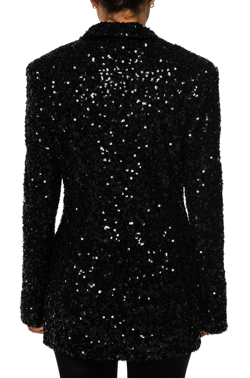 back view of shiny black sequin statement jacket with a classic blazer silhouette