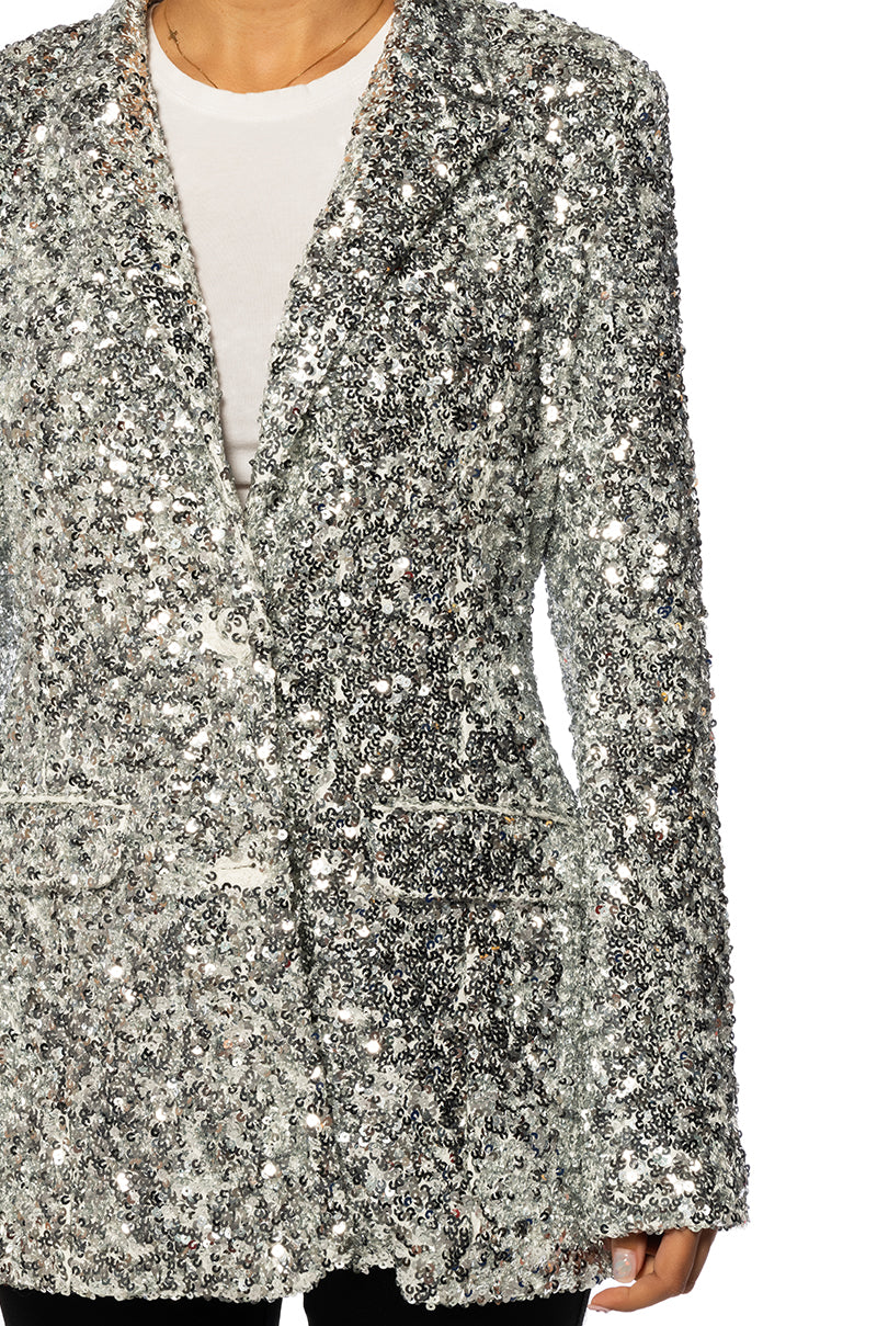 detail shot of shiny silver sequin statement jacket with a classic silhouette