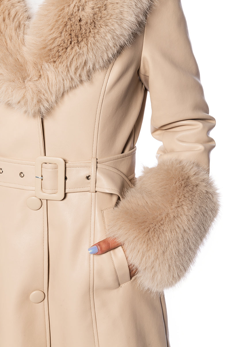 detail shot of beige faux leather knee length jacket with cinched belt waist and faux fur collar and cuffs