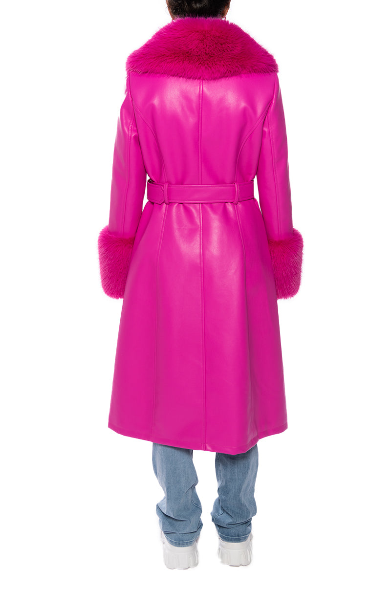 back view of hot pink faux leather trench coat with cinched belt accent and faux fur collar and cuffs