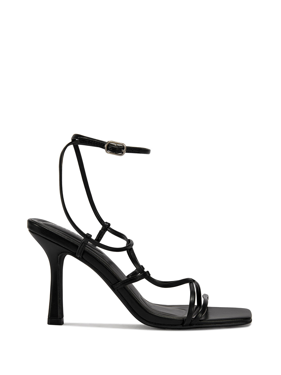side  view of black strappy heeled open toe sandals with a square toe and lace up straps