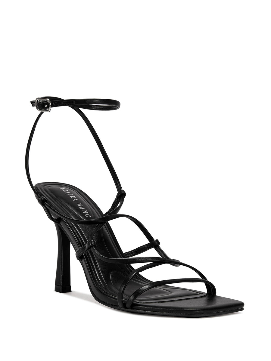 black strappy heeled open toe sandals with a square toe and lace up straps
