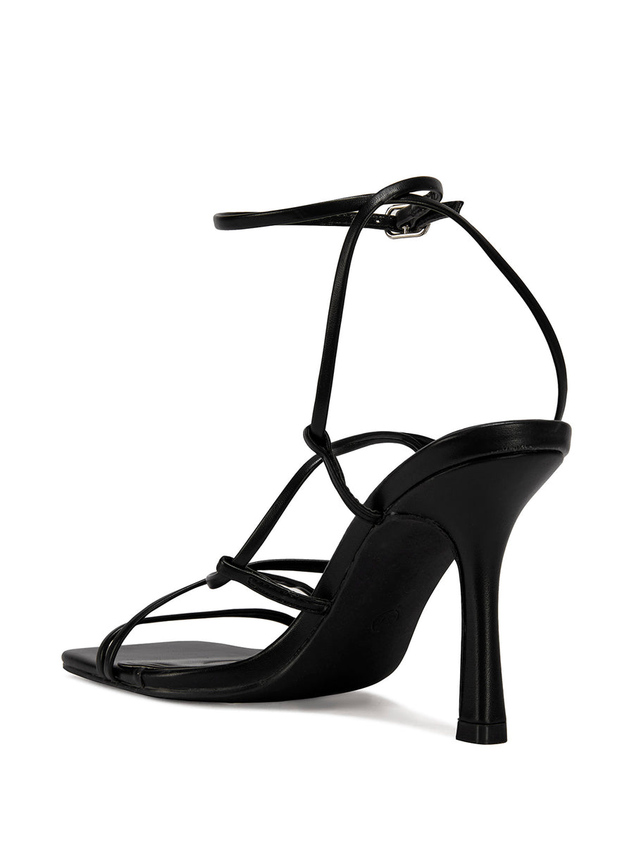 black strappy heeled open toe sandals with a square toe and lace up straps