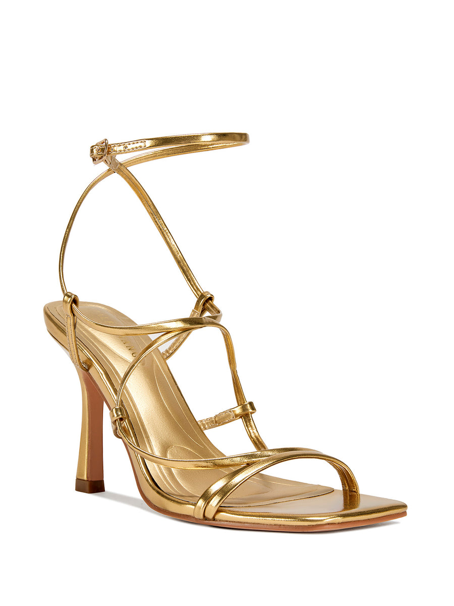 gold strappy heeled open toe sandals with a square toe and lace up straps