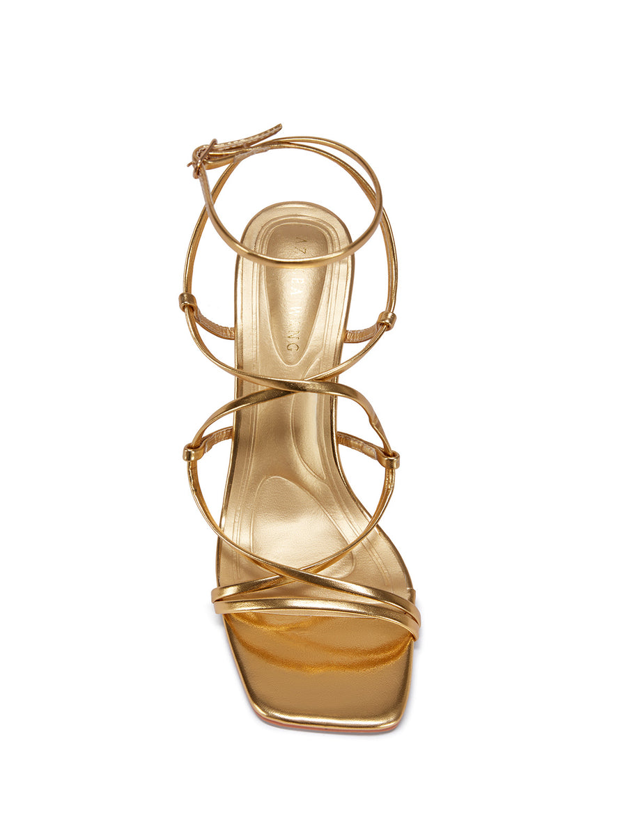 gold strappy heeled open toe sandals with a square toe and lace up straps