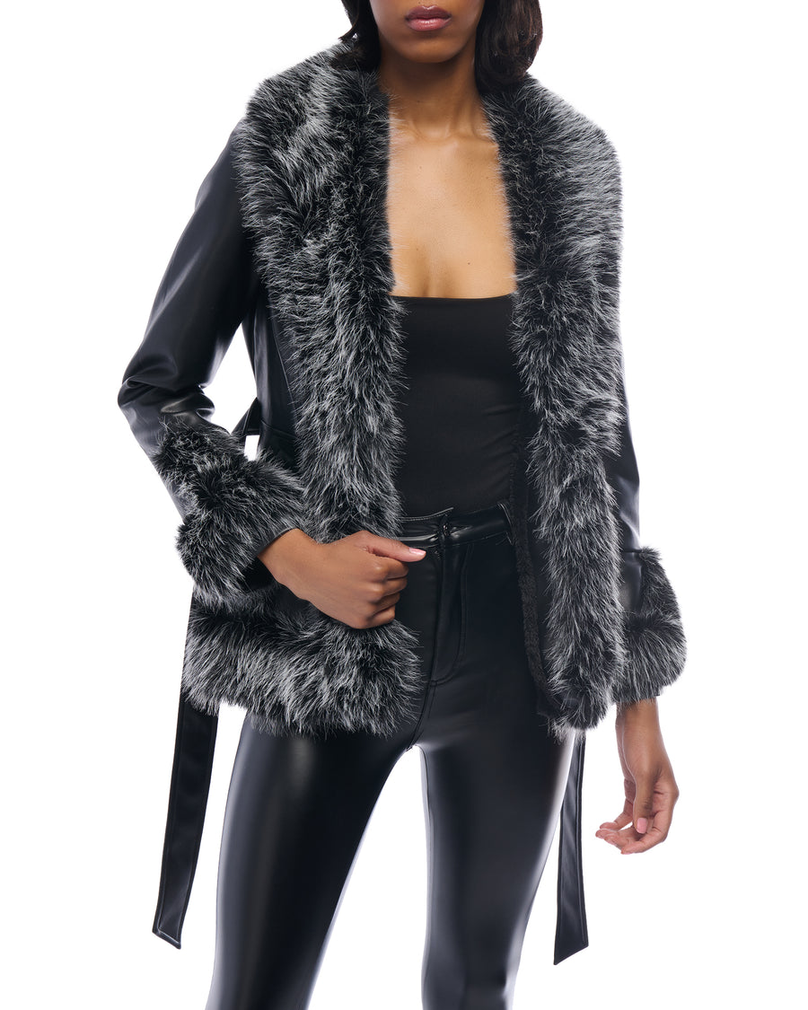 black faux leather statement jacket with a cinched waist tie up closure and black and white faux fur lined collar and cuffs