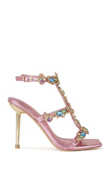 metallic pink faux leather strappy stiletto heels with an open toe construction, adjustable ankle strap, and colorful rhinestone embellishments on the straps.