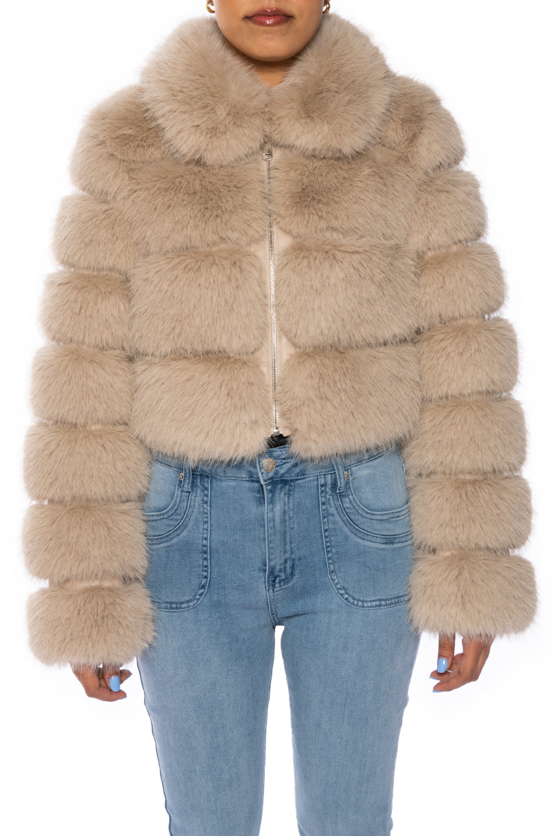 front view of luxurious cropped zip up beige faux fur jacket with accent collar