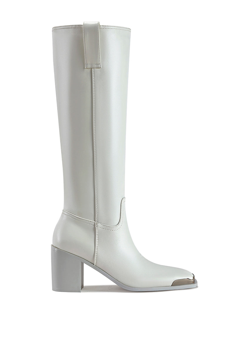 white faux leather western inspired riding boot with a silver hardware toe accent and a block heel