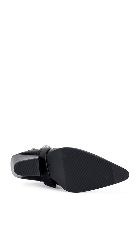 black faux leather ankle bootie with a pointed toe, block heel, and a belted accent on the upper with a chunky rhinestone embellishment