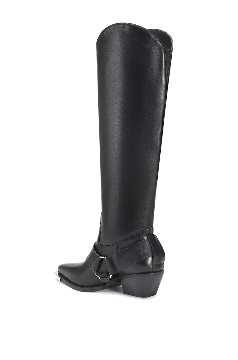 back view of black knee high western boot with a moto boot belted accent on the ankle with silver hardware on the toe