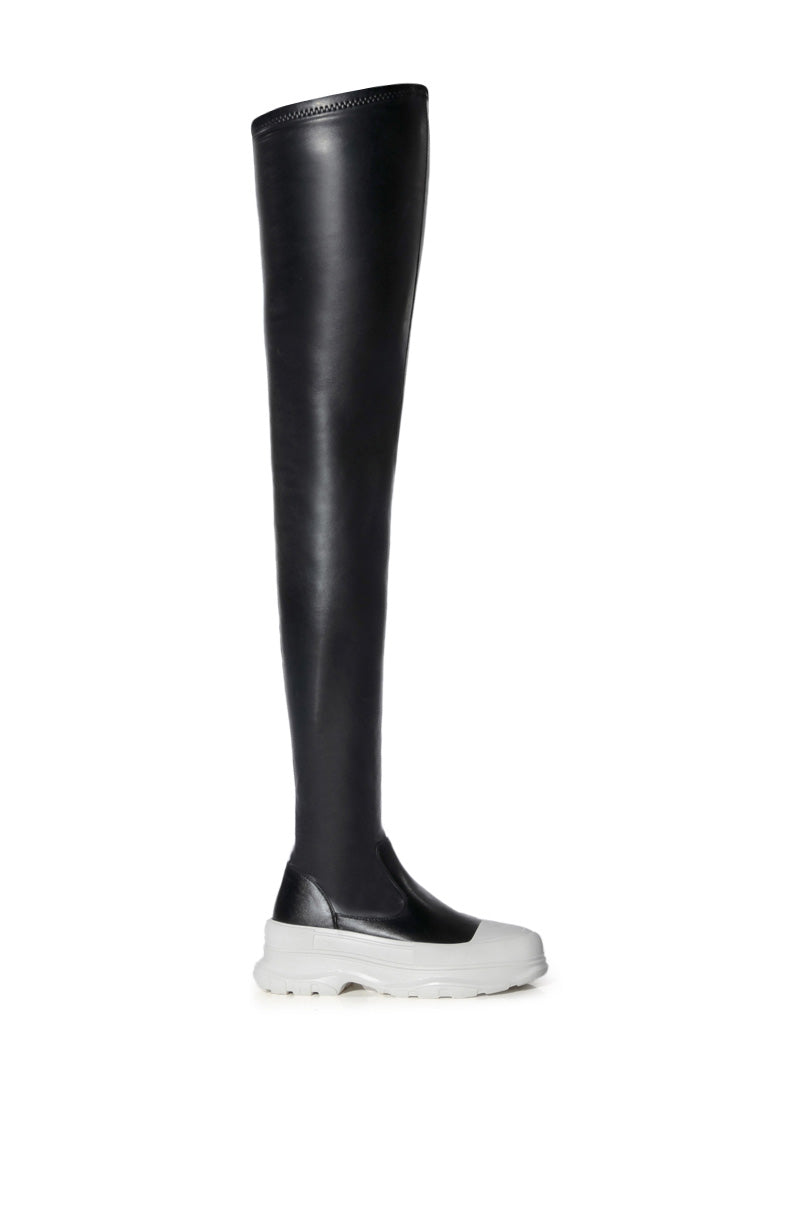 black faux leather thigh high platform boots with a white sole