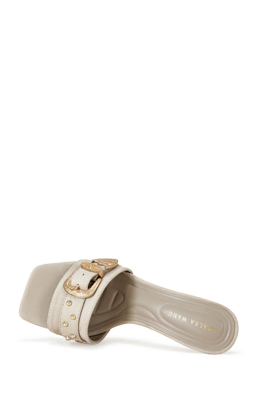 beige open toe statement stiletto heels with a gold western inspired belted accent on the strap