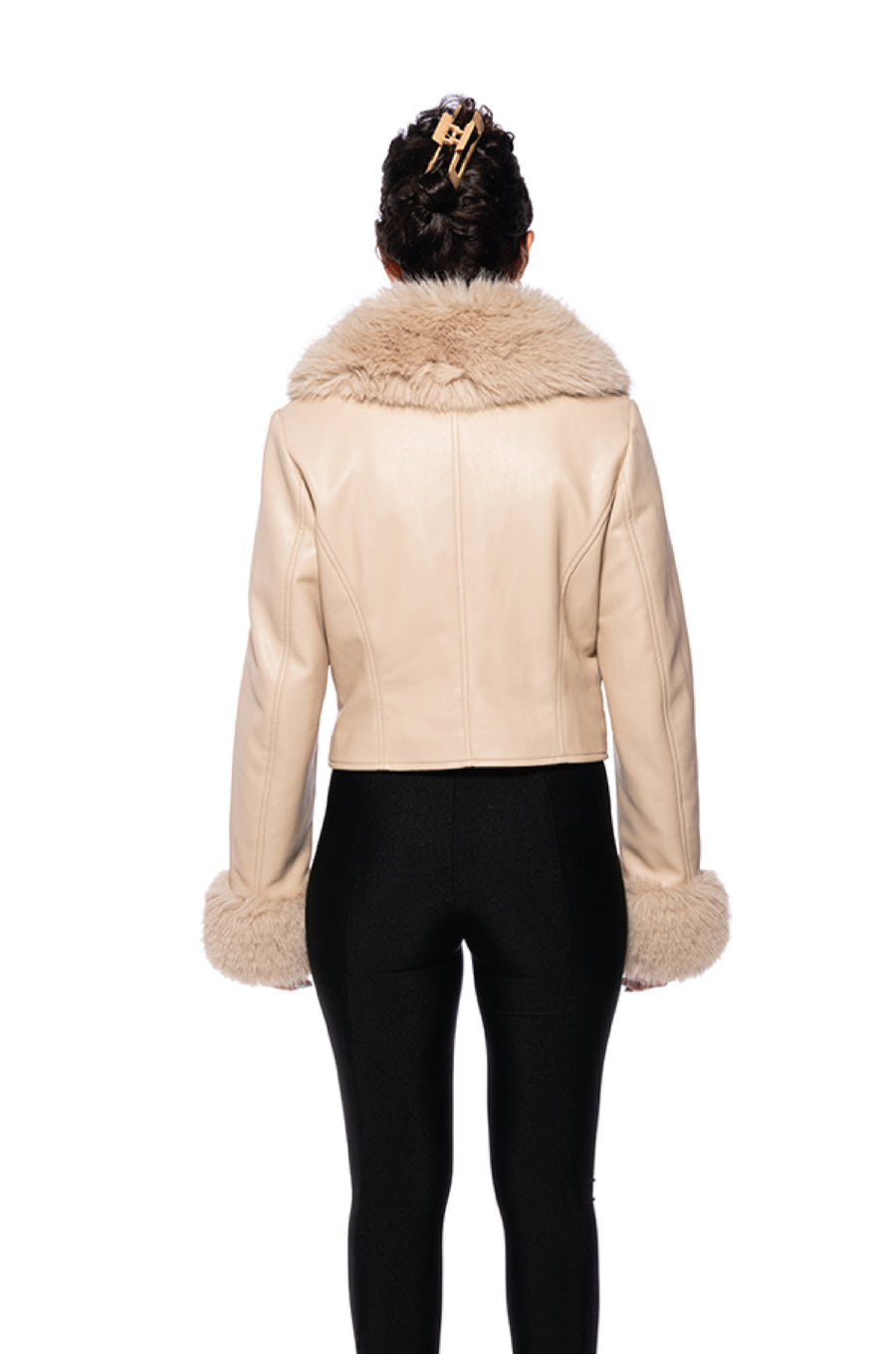 back view of beige cropped faux leather jacket with faux fur cuffs and collar