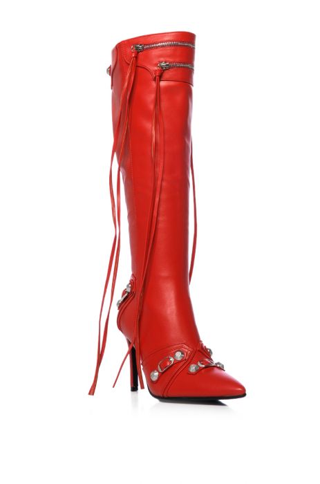 angled view of mid calf length pointed toe stiletto boots made of red faux leather fabrication, including silver hardware accents and zip closer embellishments