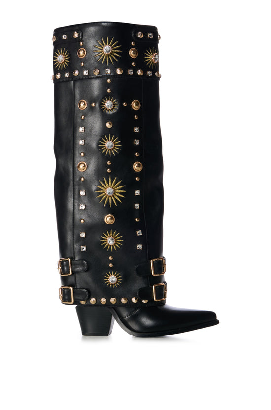 black faux leather western knee high boot with a fold over shaft stitched with sun pattern designs and embellished with gold studs and rhinestone embellishments