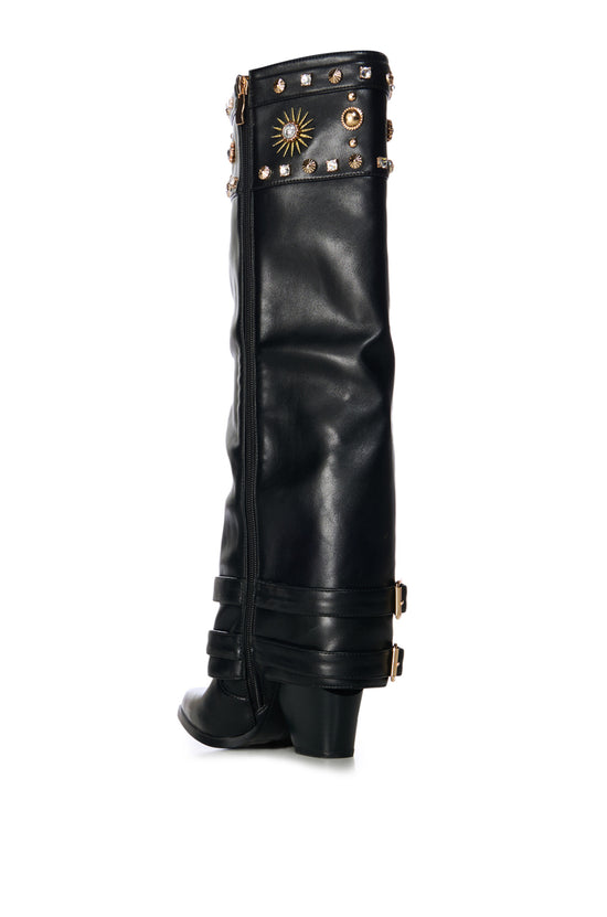 black faux leather western knee high boot with a fold over shaft stitched with sun pattern designs and embellished with gold studs and rhinestone embellishments