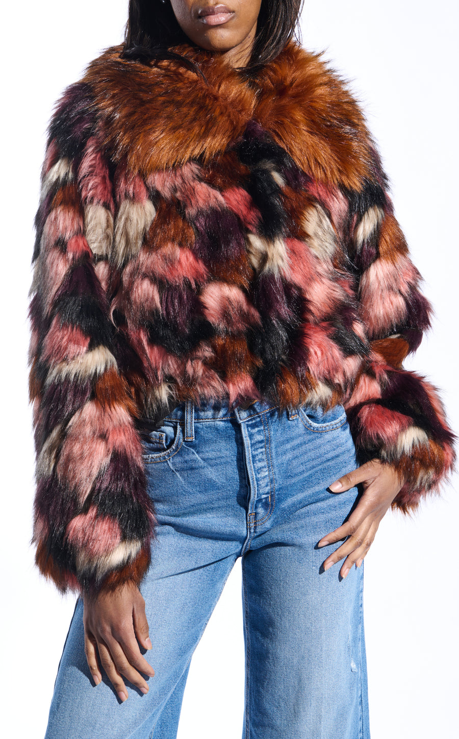 colorful pink and purple toned statement faux fur coat with a burnt orange collar and a cropped silhouette