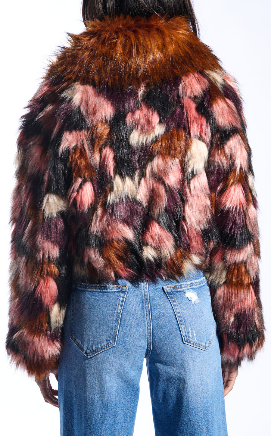 colorful pink and purple toned statement faux fur coat with a burnt orange collar and a cropped silhouette
